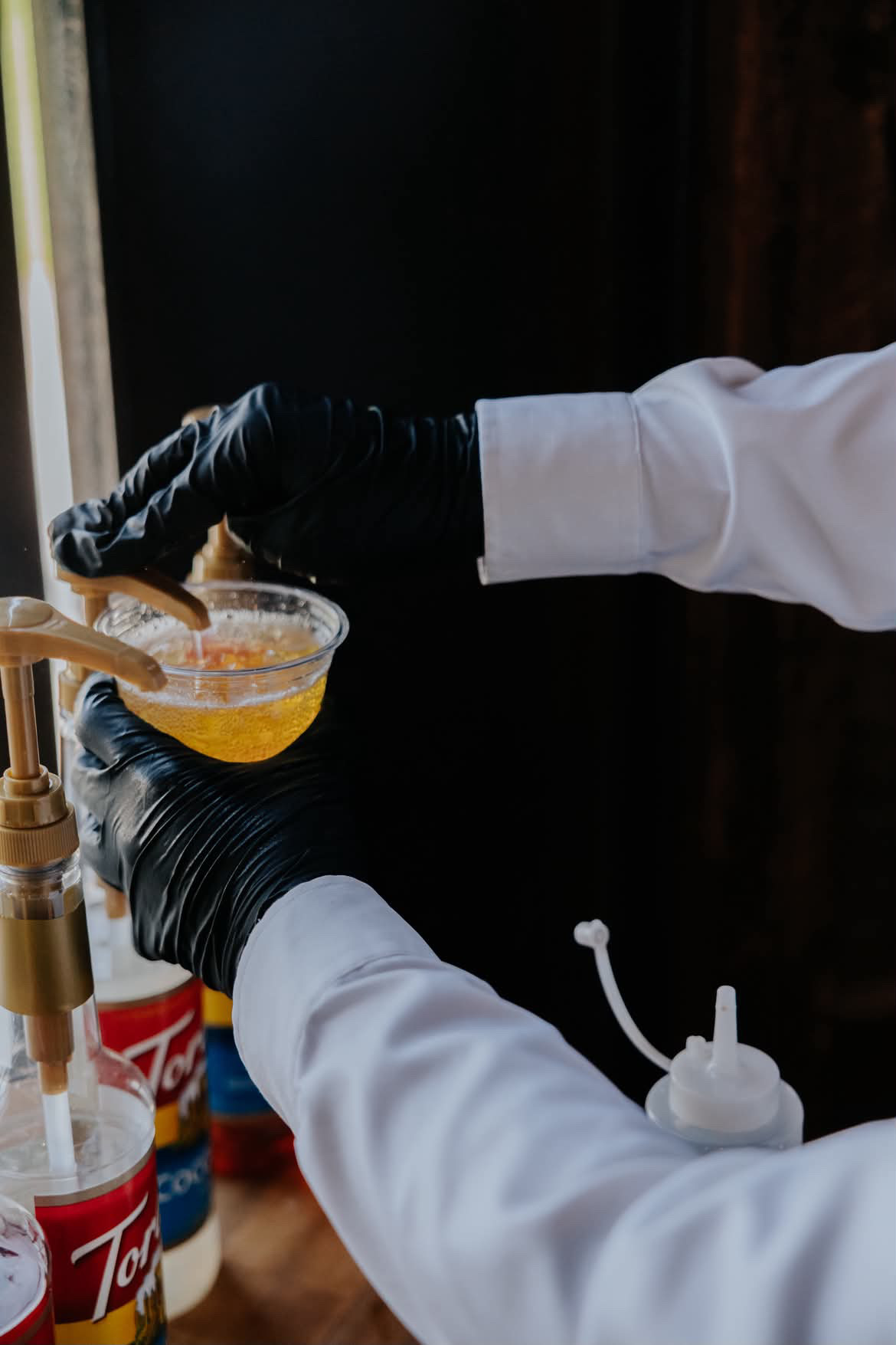 Hand-mixing a DRTY Soda drink