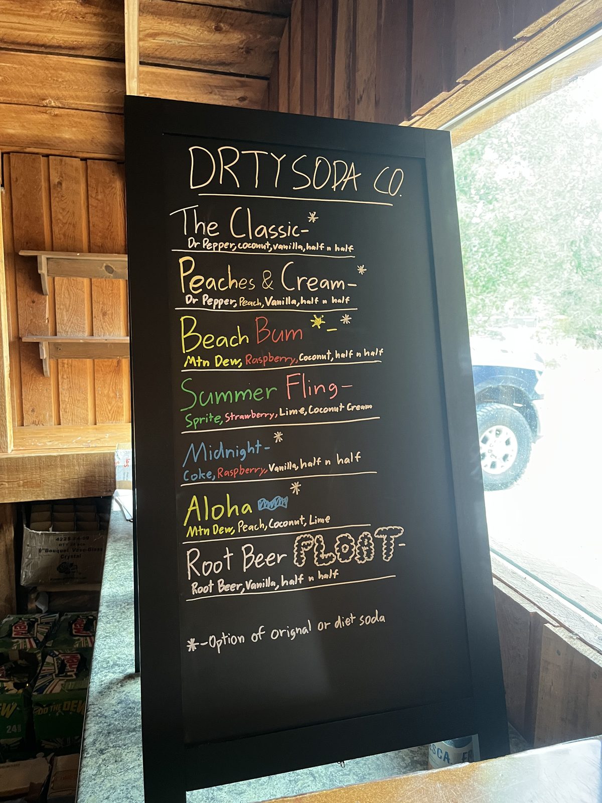 Close-up of the DRTY Soda menu board
