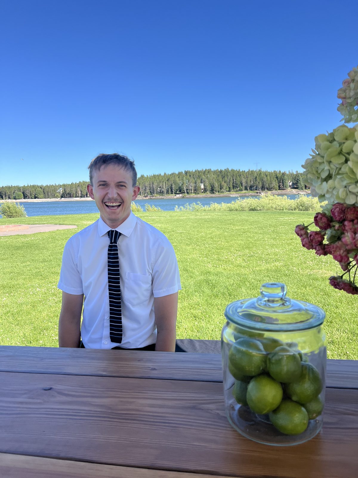 DRTY Soda bartender smiling at a lakeside event