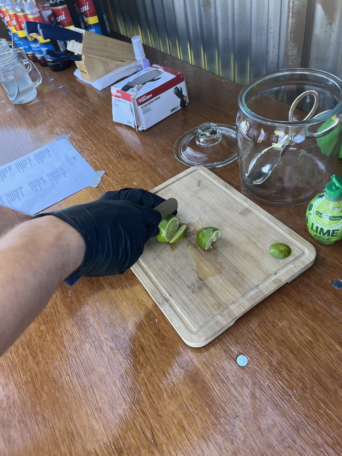 Bartender slicing fresh limes for dirty sodas